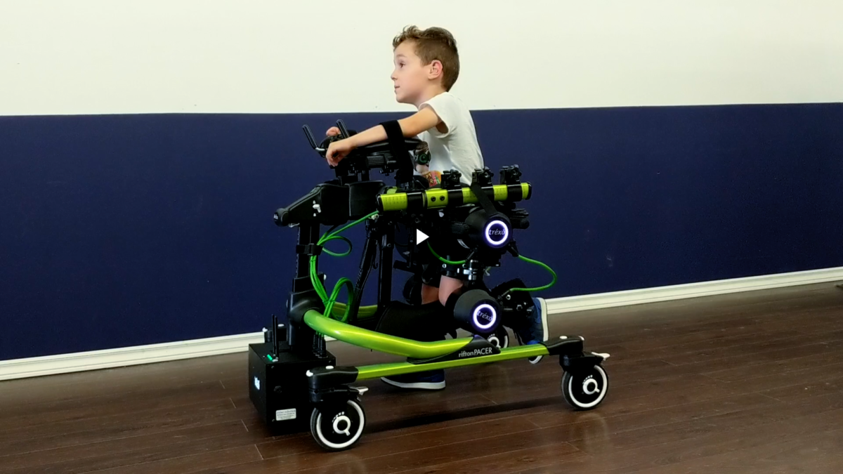 Boy walks with assistive device, Trexo Plus