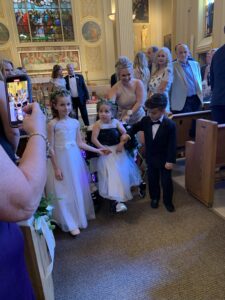 Flower girl walking down the aisle with her Trexo